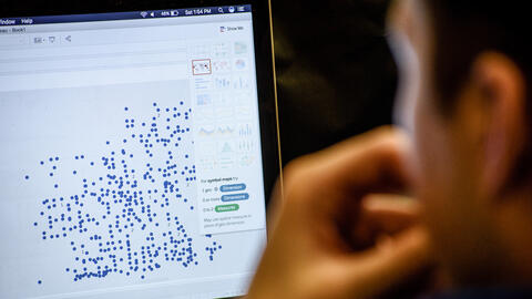 Person looking at a data visualization on a laptop