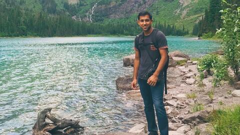 Ani Madurkar standing by river