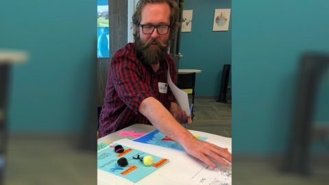 Matt Garvin works on a project at the UMSI engagement center
