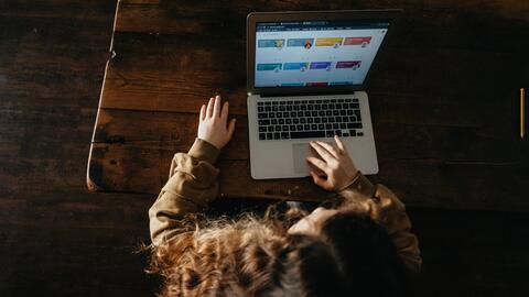 Overhead shot of a young person using a computer