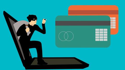 Illustrated graphic shows burglar in mask with sack emerging from laptop screen, approaching two credit cards.