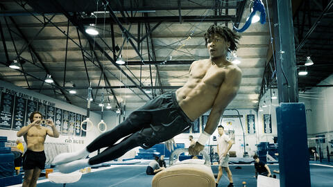 Uche Eke performs a routine on pommel horse during a training exercise. 