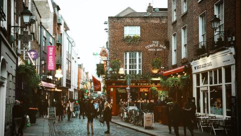 Temple Bar, Ireland, a busy street spread over cobbled pedestrian lanes. 