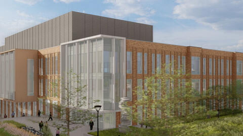 The north elevation of the Leinweber Building looking west. The three-story building has many tall, vertical windows. 