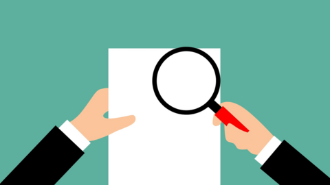 An illustration of two hands holding a piece of paper and an magnifying glass. 