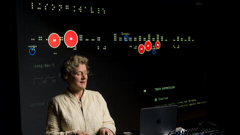 Professor of Information Sile O’Modhrain uses the Codex, a refreshable braille display, to edit audio in a studio at the U-M School of Music, Theater and Dance.