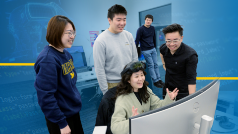 Anhua Wu wears an XR headset while gesturing at a computer screen, with four people gathered around behind her. The image has a transparent blue background featuring collaged elements like code and a headset