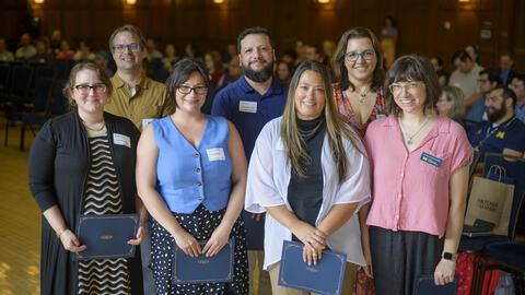 The HR team poses holding their awards.
