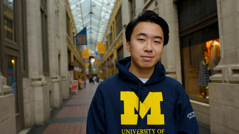Vincent Wei stands in Nickels Arcade in downtown Ann Arbor
