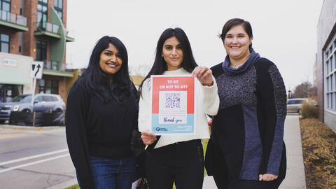 Students pose in downtown Ferndale with a QR code