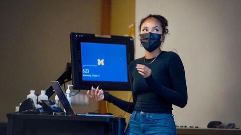 Students present their designs in the classroom.