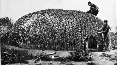 A black and white drawing of a straw hut