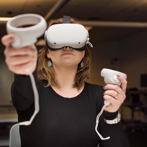 Chloe wears a VR headset