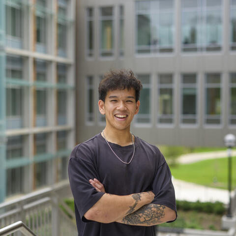 MHI student Danny Nguyen standing outside the Leinweber building