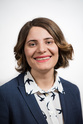 A photo of Naz Andalibi. She is wearing a blazer and smiling. 