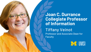 Tiffany Veinot, professor and associate dean for faculty, is appointed Joan C. Durrance Collegiate Professor of Information. Veinot is pictured in an orange shirt and glasses. She is smiling. 
