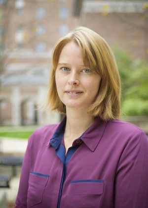 Sabina Tomkins standing in the North Quad courtyard