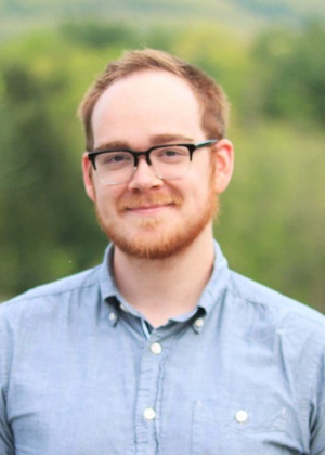 A headshot of Adam Freed