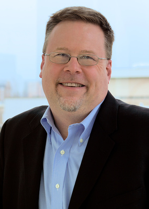 A headshot of Allen Flynn