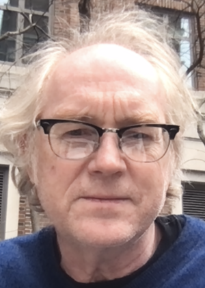 A headshot of David Wallace