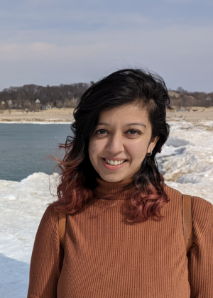 Anjali Singh standing in front of a lake