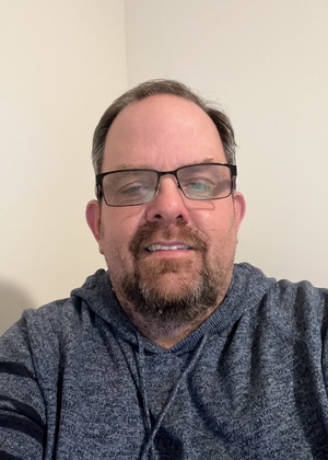 A headshot of Ed Hennessey