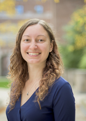 A headshot of Gabriela Marcu in the North Quad courtyard