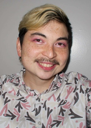 A headshot of Hibby Thach