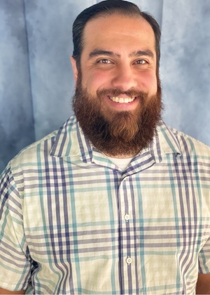 A headshot of Helmi Barzak