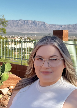 A headshot of Cassidy Pyle with a mountain in the background.