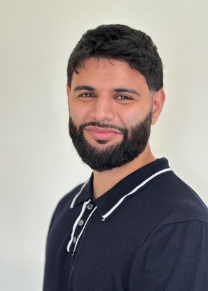A headshot of Kenan Alkiek