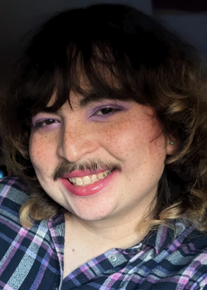 A headshot of Hibby Thach