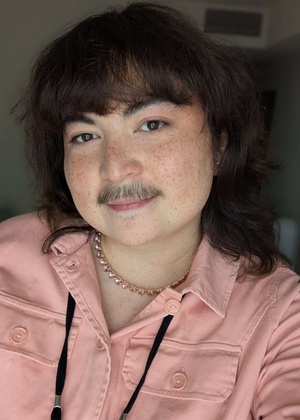 A headshot of Hibby Thach
