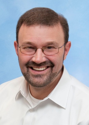 A headshot of Sam Keith