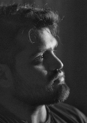 A black and white headshot of David Gamba