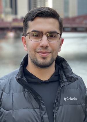 Isa Pocan in front of a river and a bridge