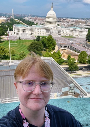 A selfie of Jasper Forster taken on top of the Jefferson building dome of the Library of Congress with the Capitol building in the background.