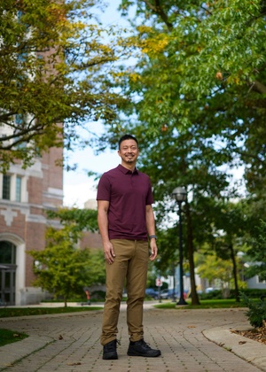 Jeff Sheng poses in the North Quad courtyard near Rackham