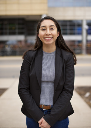 Alexis Villafranca standing in front of Michigan Medicine