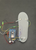 Prototype for InStride made of a Dr. Scholl's insole connected by wires to a development board.