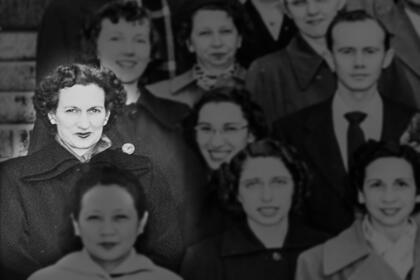 Martha Boaz posing with a large group of students in 1952 on the steps of Angell Hall.