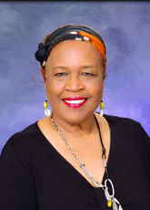 A headshot of Lou Devine Sanders