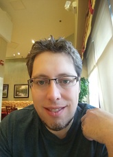 A headshot of Paul Belser