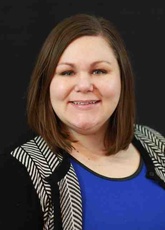 A headshot of Amy Homkes-Hayes