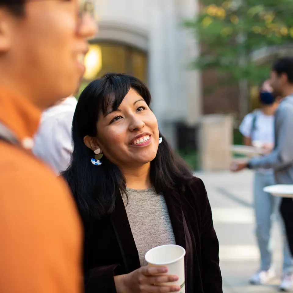 UMSI PhD students mingle during CommuniTea in the North Quad Courtyard.